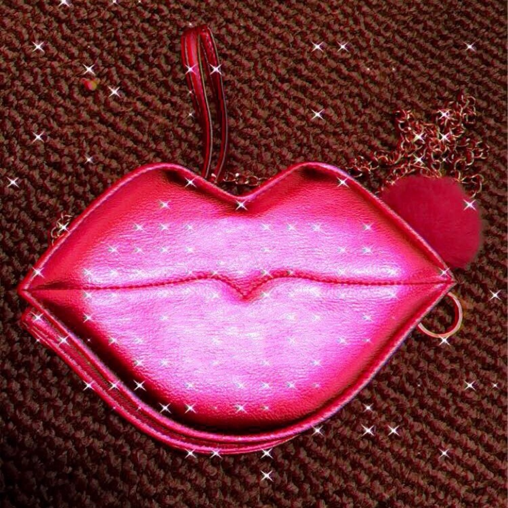 Pink Lip shaped purse .